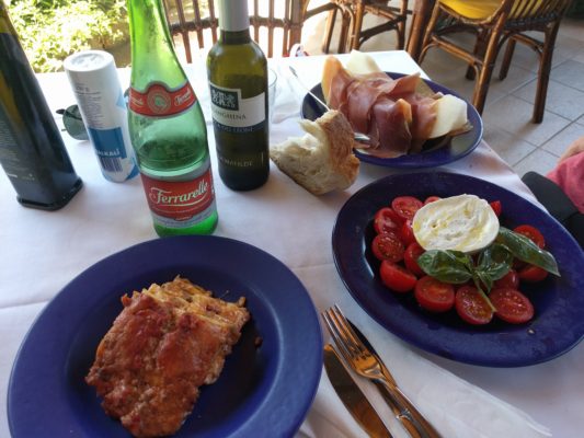 Lunch - lasagna, caprese salad, prosciutto and melon plus sparkling water and some white wine