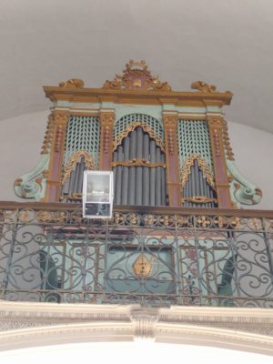 The pipe organ on the balcony above the door at the rear of the narthex