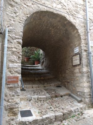 Steps going up under a short archway