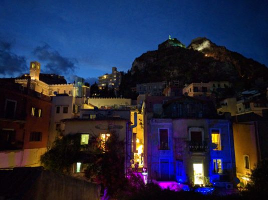 View up hill from our place - there was a popular bar/lounge right there lit up with blue and purple lights at night