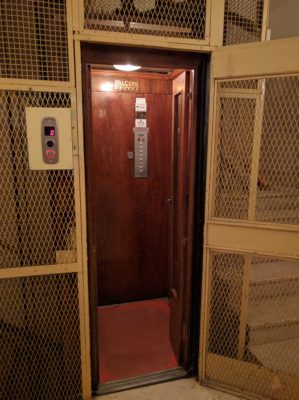 The elevator in our apartment building - yes, it's the size of a phone booth and about as ancient as landline technology