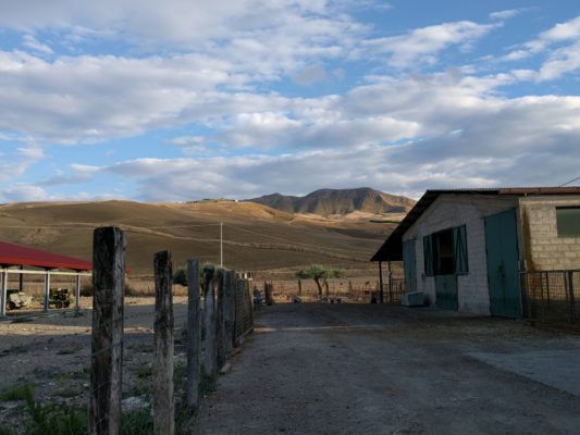 The barn and fields beyond