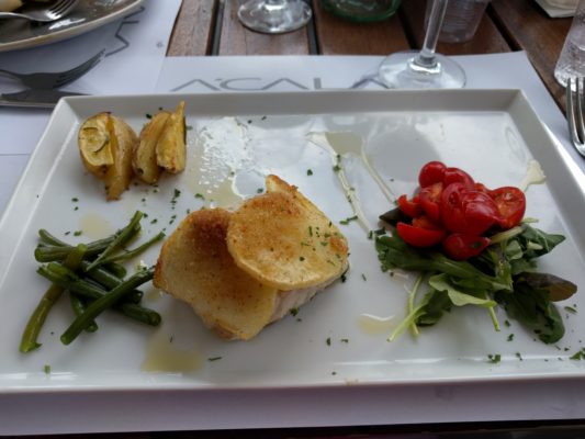 My lunch - beneath those potato slices is a delicious fish called "croaker"