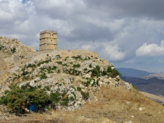 An old watchtower on the side of the road, out in the middle of nowhere