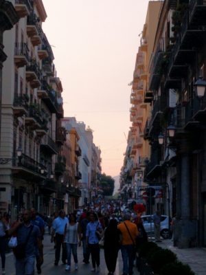 The evening passagiata on Via Maqueda near our apartment, shoulder-to-shoulder people in the street