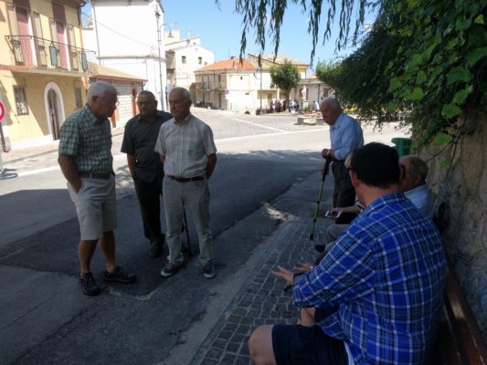 socializing in front of Adolfo's house