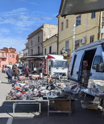 a view of the kitchenwares vendor at the weekly market