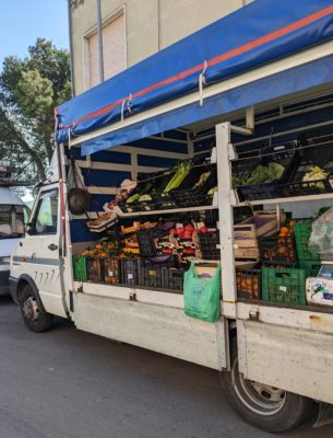 the fruit and vegetable vendor at the local market