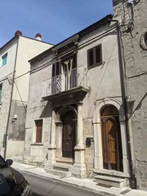 the door to our upstairs apartment is the lighter wood door on the right