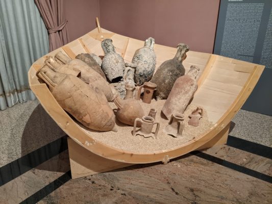 A replica of a ship's bow shows how goods were transported and traded with other cultures - these jars would hold wine, oil, sauces, fish sauce, and fruit