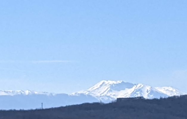 A close-up of the snow-capped mountains across the valley