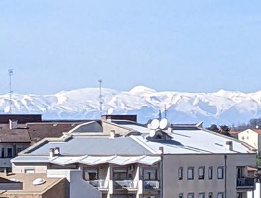 The mountains nearby are still covered in snow