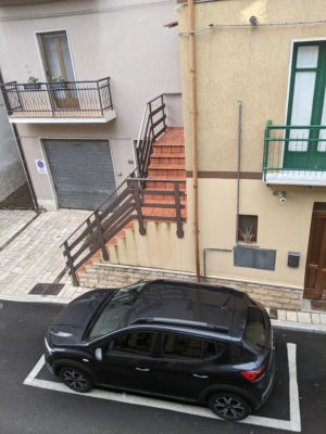 here's our little car parked in front of our apartment - just before lunch today, it was surrounded by little boys checking it out since it's an out-of-town car