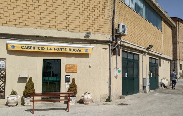 Caseificio La Fonte Nuova - the person-sized door is the entry to the shop and the garage doors lead into the cheese-making area