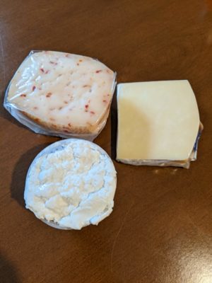 the cheese on the top left has hot peppers in it, the cheese on the top right is an aged/hard/flavorful cows cheese, and the bottom left is soft ricotta which I'm sure was made just hours before we bought it