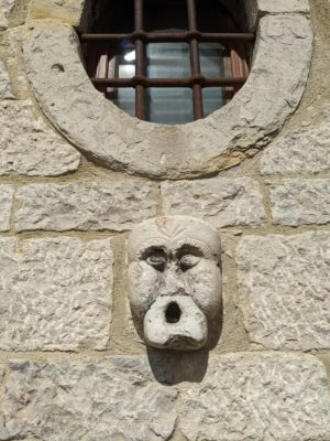 I like this carved face on the side of a house