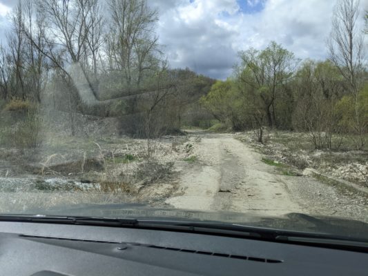 this is where Chad and I had a "What in the world?" moment - a little bridge on a gravel road, and if you squint, you can a tiny bit of the stream on the left