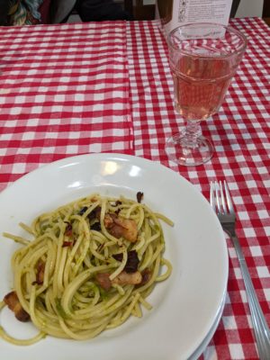 pasta with wild asparagus and pancetta (bacon) and and glass of organic rose wine