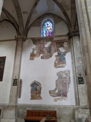 at some point the duomo was renovated with new plaster on the walls, but the old frescos were left to be seen