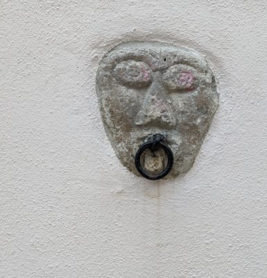 we saw this funny face on the side of a house - perhaps the metal ring was where you could tie up your horse