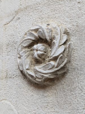 I like this carved stone rosette which is part of an entry portal for a house