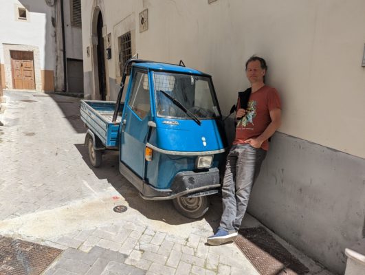 Chad with his dream car, an Ape - "ape" means "bee" which, if you hear one of this cars, you will understand why it is called a "bee"