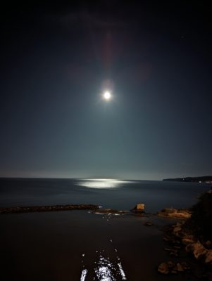 a full moon over the sea at Vieste