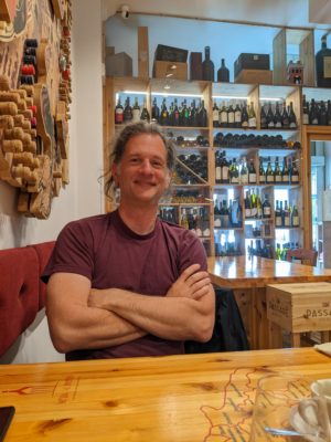 Chad at the restaurant - the wine bottles in the background are actually a wine shop that you walk through in order to enter the restaurant