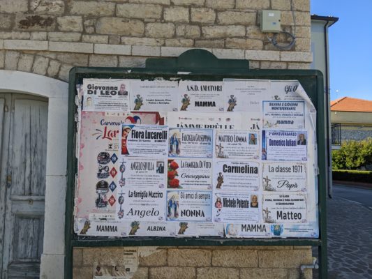 towns in Italy have community boards with announcements about deaths and funeral services