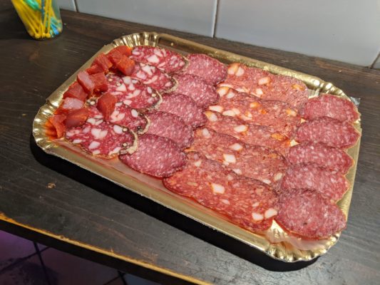 our salumi tasting plate - I don't remember all of the descriptions, but the chunks on the left are part of a big meat stick, the next is typically eaten at Easter, the third is made with Barolo wine, the fourth was delicious, and the far right is made with truffles