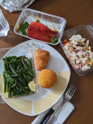 this is the Italian version of take-out - green beans, arancini, seafood salad, and a roasted pepper stuffed with bread crumbs and cheese