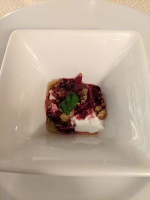 an amuse-bouche of local cheese with pickled beets and basil