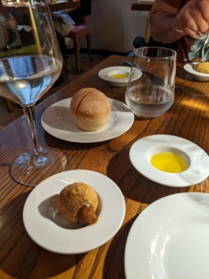 the first amuse-bouche was a beef dumpling with mushroom cream accompanied by housemade bread and olive oil, and a glass of prosecco from Veneto