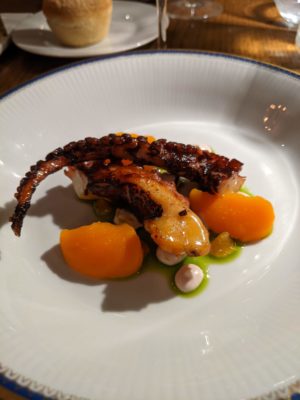 crispy octopus, mashed carrots with lemon, cream mousse and herb sauce, Vermentino white wine