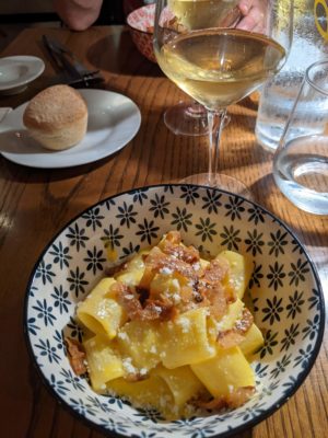 pasta carbonara with a kind of egg cream sauce and Italian bacon, regional white wine