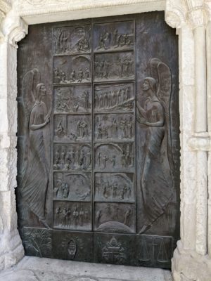 the door of the church that wasn't thronged by tourists