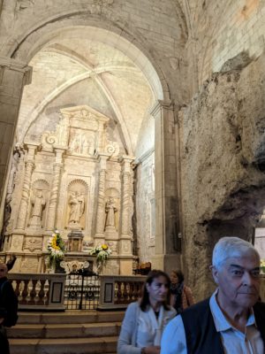 down in the cellar where the "new" church meets the face of the cave