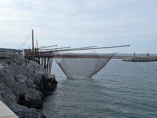 a trabocco - a traditional fishing pier which is common along the east coast of Italy, nets are hung from the pier to catch schools of fish as they swim by