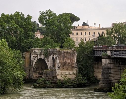 in the middle of the photo, you can see the remains of the ancient Roman bridge with the modern bridge behind it