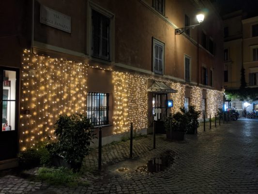 the facade of this restaurant was covered in lights