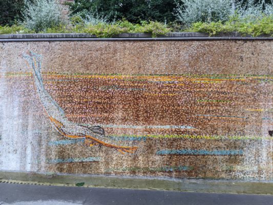 a mosaic mural of a swimmer